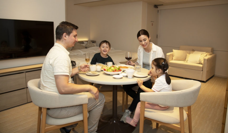 Family enjoying in-room dining
