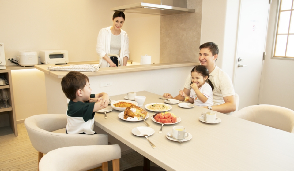 Family enjoying in-room dining